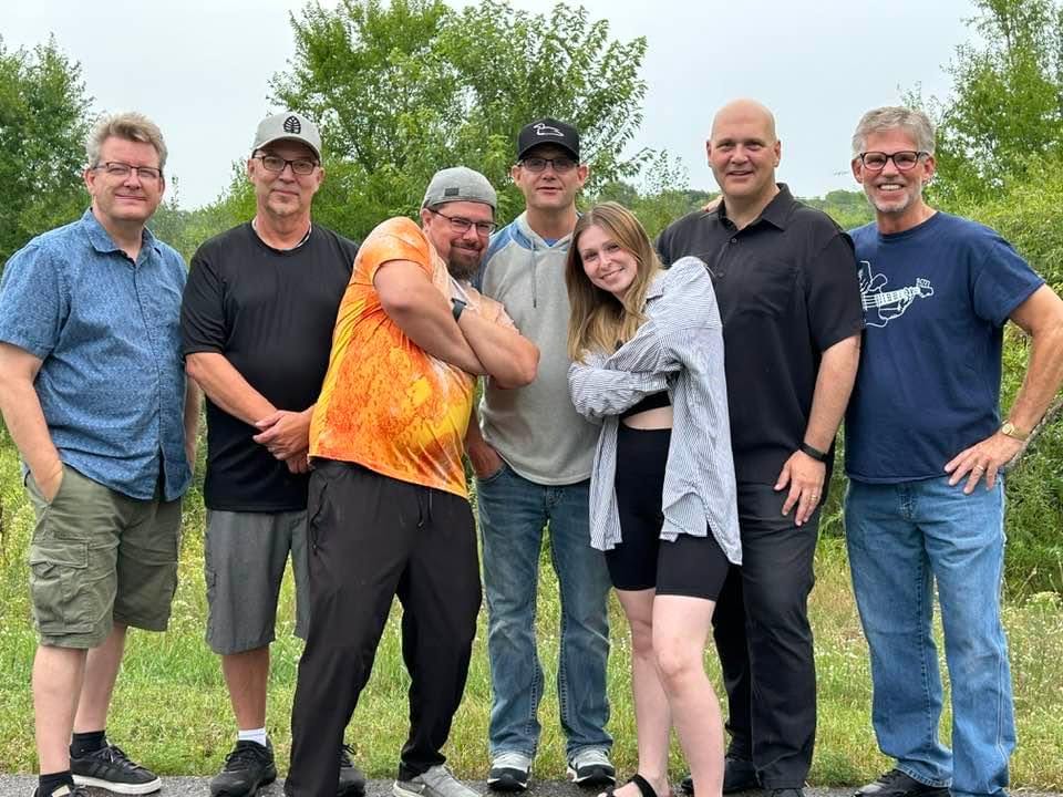 The seven members of Humboldt Station standing together outdoors